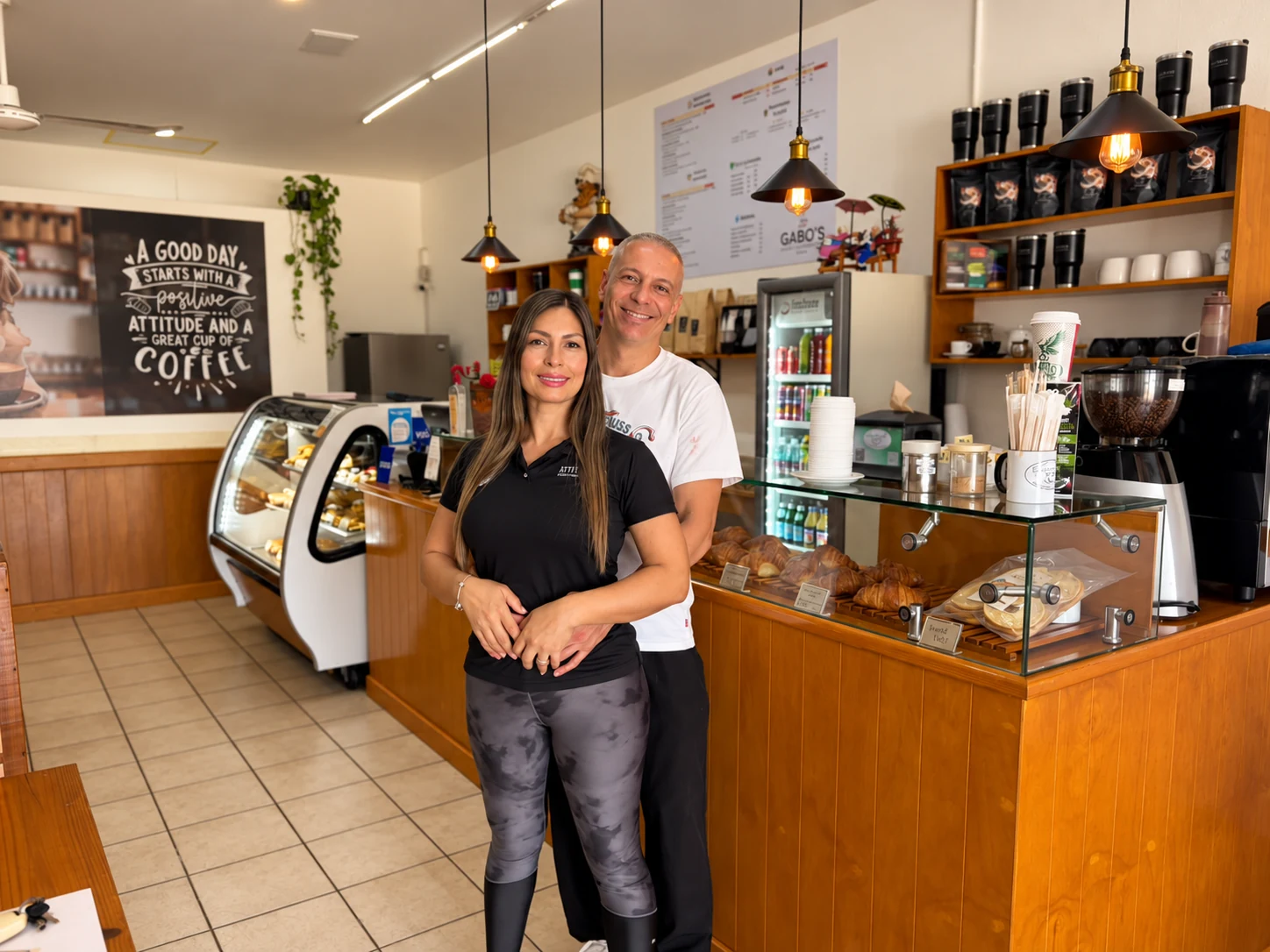 The owners of La Caffetteria inside their Playa del Carmen café